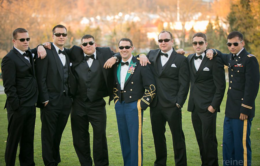 groomsmen pose for photographers at Downingtown Country Club