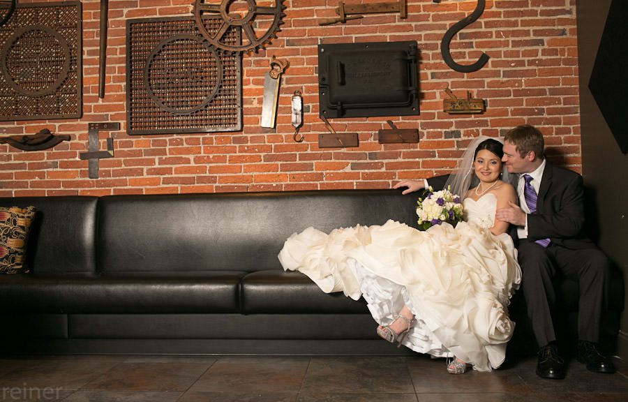 wedding photos at the Cork Factory Hotel wedding couple pose for photography inside the Cork Factory Hotel in Lancaster PA