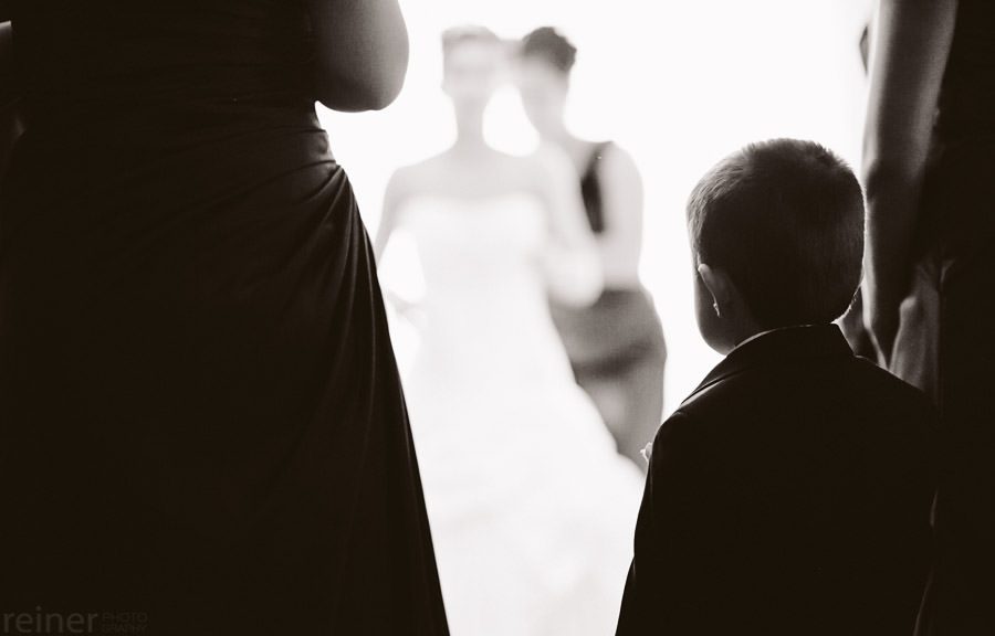 bridesmaids helping bride into her dress - Allentown PA wedding photos by Reiner Photography