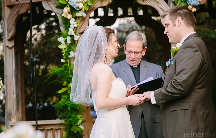 Columbia Station wedding photographers - bride and groom at their ceremony by Reiner Photography