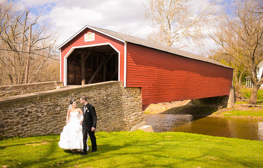 bride and her groom at Kriedersville covered bridge in Northhampton PA - Allentown PA wedding photos by Reiner Photography