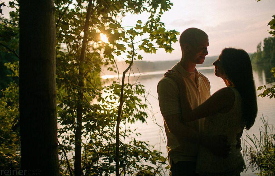 couple near a lake for their engagement session