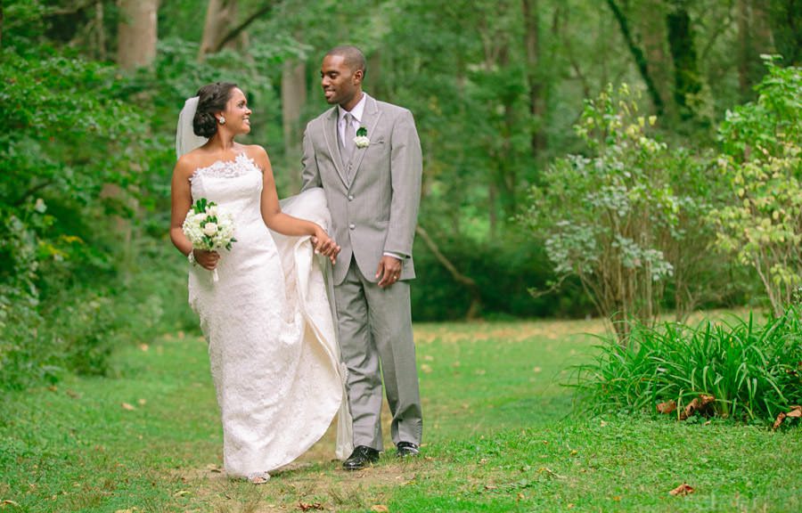 Bride and Groom stroll by creek Media Old Mill Rose valley PA