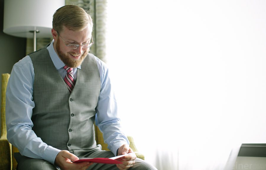 photos of groom opening gift