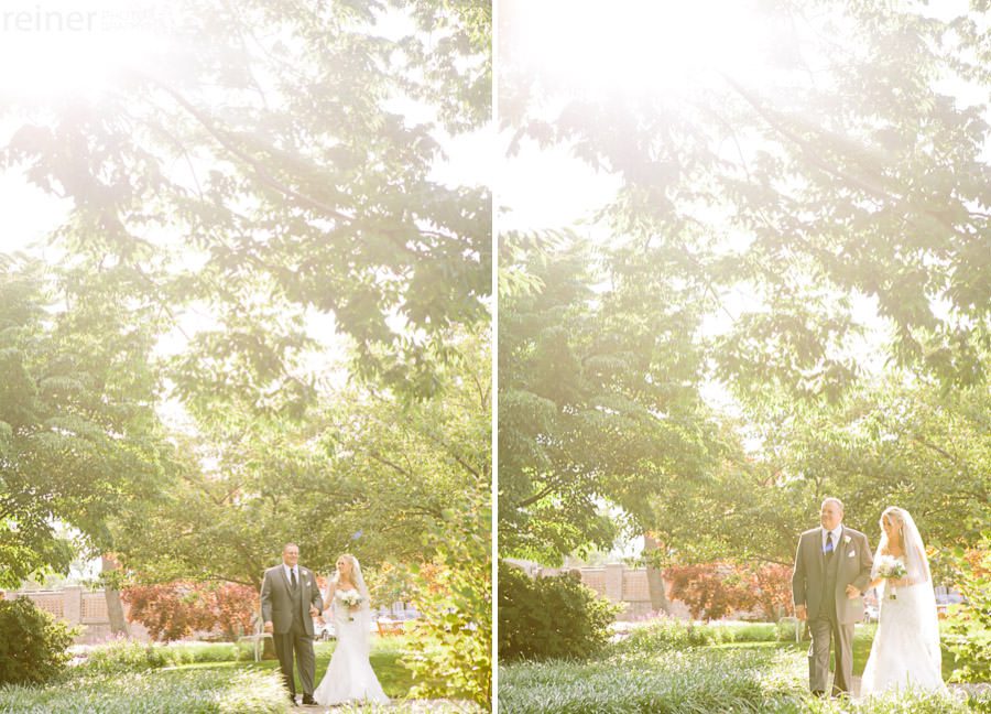 sunlit photos of bride and her dad walking to wedding ceremony