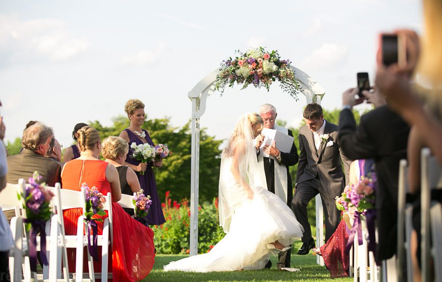bride and groom stomp glass at wedding