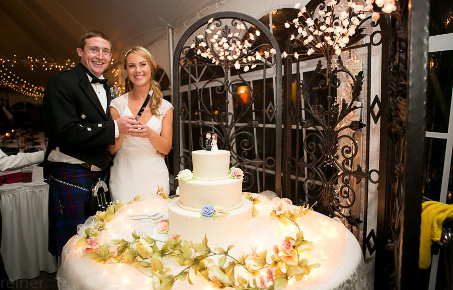 cutting the wedding cake - Meredith Manor in Pottstown
