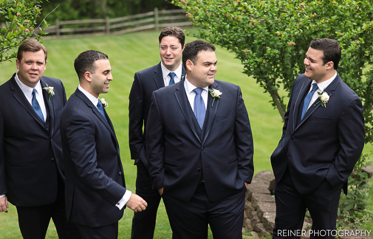 groomsmen pose for photos before the Warrington Country Club Wedding