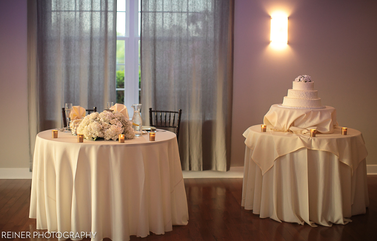 reception decorations and table settings at bride and groom portrait photos at a Warrington Country Club wedding