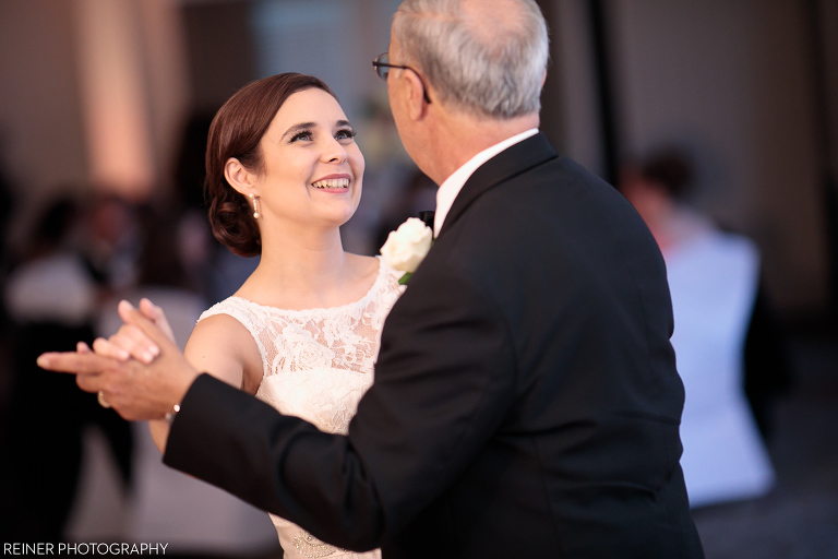 bride smiling at father